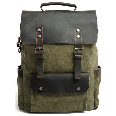 Zijaanzicht van de vintage rugzak van canvas en leer